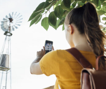 young-girl-taking-picture-windmill